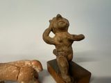 two figurines of a bear and a dog on a table