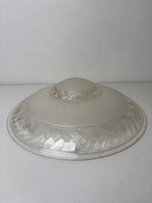 a clear glass lid on a white counter top
