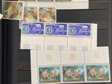 a lot of different stamps on a shelf in a room