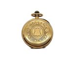 a gold pocket watch on a white surface with a white background