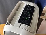 a toaster sitting on a table with a box in the background