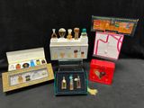 many different types of perfumes in boxes on a table