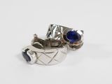 silver ring with a blue stone and a silver band