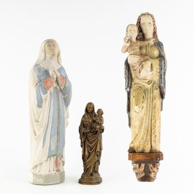 three figurines of jesus, mary, and jesus on a white background