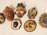 several different types of masks are displayed on a white surface