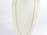 a close up of a mannequin with a necklace on it