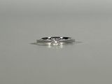 a close up of a diamond ring on a table