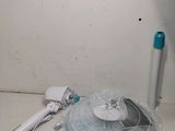 a fan that is sitting on the floor next to a blow dryer