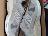 new balance shoes in a box on the floor
