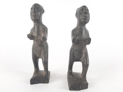 these are two figurines of a man and a woman on a white background