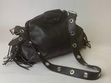 leather handbag with fringes and rivets on a white background