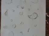 a piece of paper with drawings on it on a table