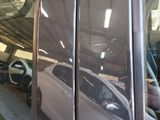 a reflection of a car in the window of a car