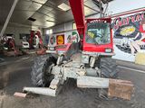 a red crane that is parked in a garage