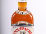 an image of a bottle of brandy sitting on top of a table