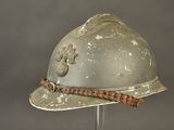 a helmet on a stand with a rope around it