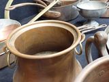 many pots and pans that are on the table