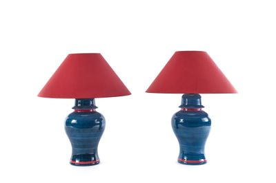 pair of blue and red table lamps with red lampshads