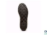 the sole of a pair of shoes is shown against a white background
