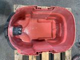 a red plastic container on a pallet on a pallet