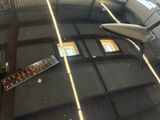a ruler on the windshield of a car in a garage