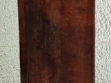 a small wooden box with a handle on a table