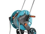 a blue hose cart with wheels and a hose attached to it