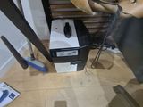 a chair that is sitting next to a box on the floor