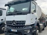 two trucks parked next to each other in a parking lot