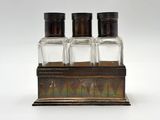 three salt and pepper shakers sitting on top of a wooden stand