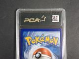 a close up of a pokemon card in a plastic case