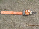 an image of a chainsaw laying on the ground
