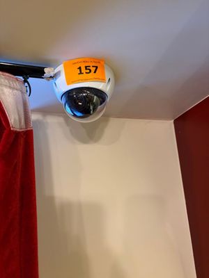 a picture of a security camera mounted on the ceiling