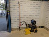 a machine that is sitting on the ground in front of a wall