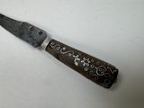 a knife that is sitting on top of a table