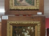 two paintings hanging on the wall in the room