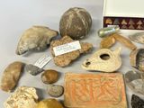 many different types of artifacts displayed on a table