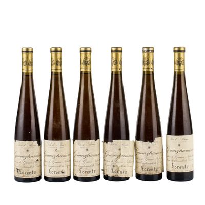 six bottles of wine are lined up in a row