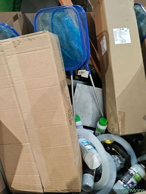 a pile of boxes and other items in a room