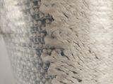 a close up of a vase with a white and blue design on it