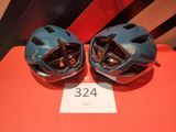 two helmets on a table with a price tag on it