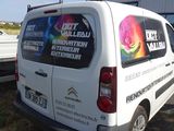 a van that is parked next to a truck