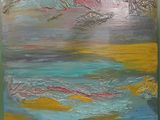 painting of a painting of water and clouds in a green frame
