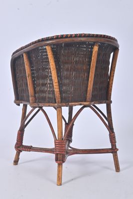 a wicker chair that is sitting on a white surface