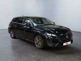 the black car is parked in a white room with a black floor