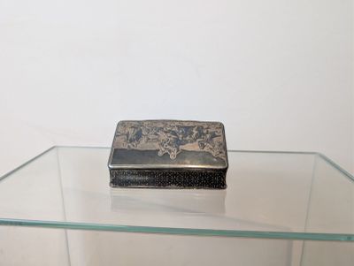 a glass table with a small box on top of it