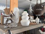 a shelf that has some vases and other items on it