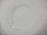 a close up of a white plate with writing on it