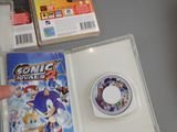 a person pointing at a video game on a table