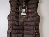 a close up of a vest on a hanger on a wall